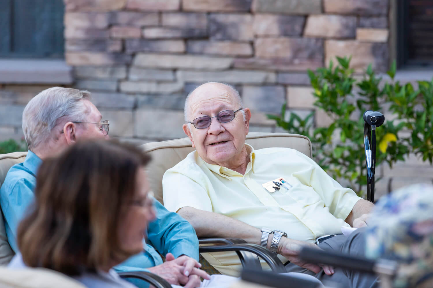 Men talking in lounge chairs